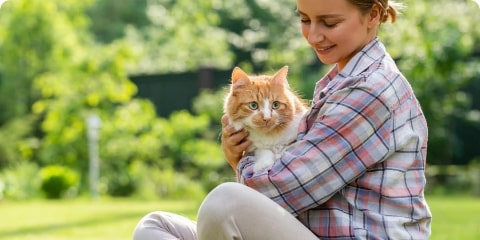 girl with a ginger cat